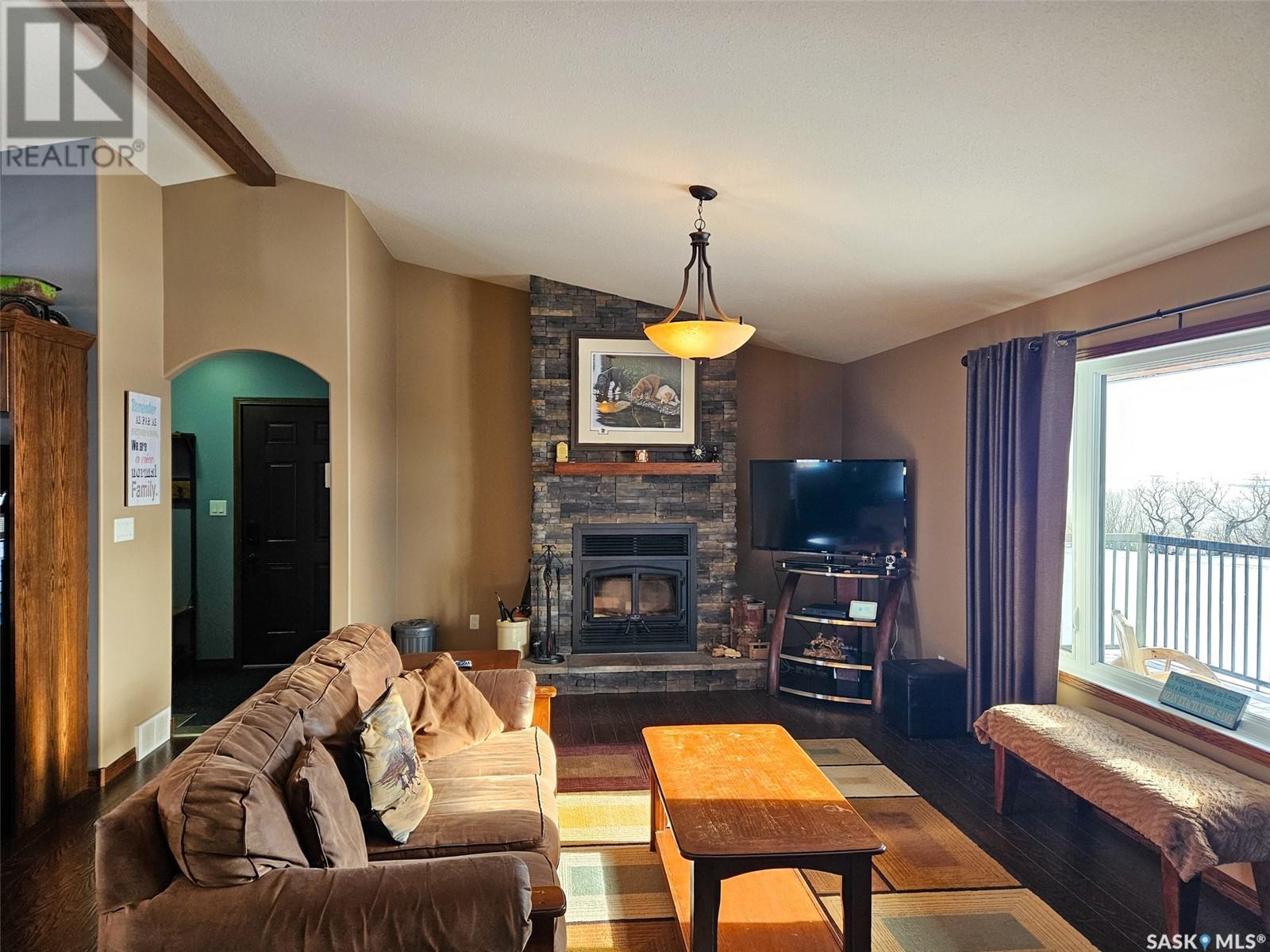 Chandler Acreage, Wood River Rm No. 74, SK - Indoor Photo Showing Living Room With Fireplace