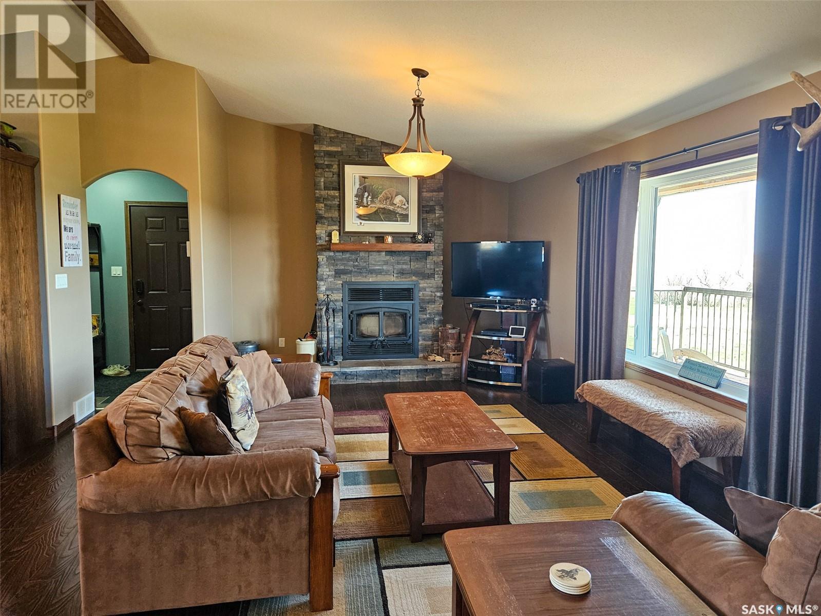 Chandler Acreage, Wood River Rm No. 74, SK - Indoor Photo Showing Living Room With Fireplace