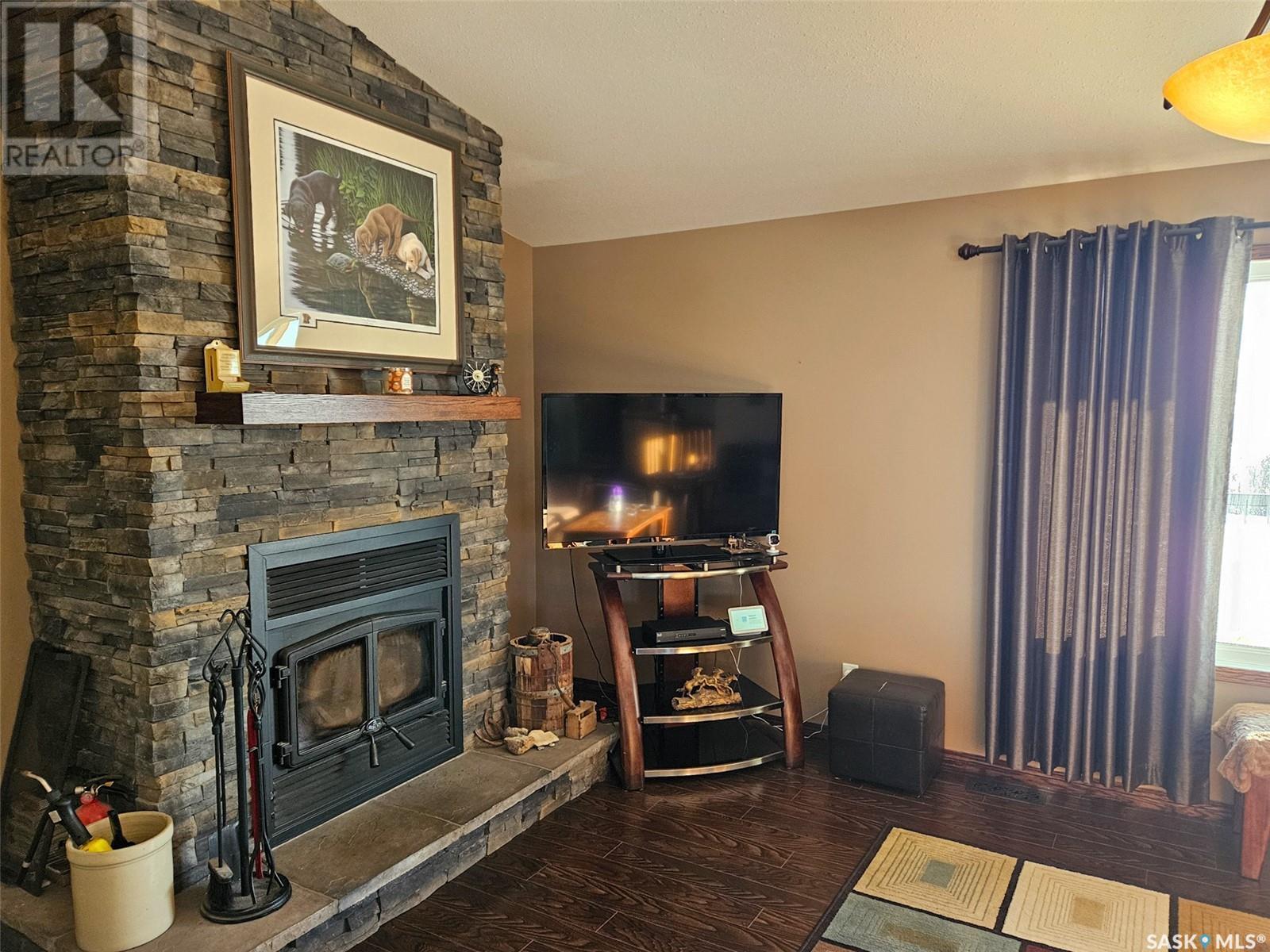 Chandler Acreage, Wood River Rm No. 74, SK - Indoor Photo Showing Living Room With Fireplace