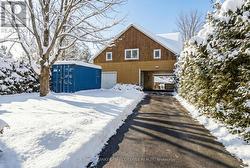 Large garage with loft and attached carport -