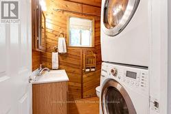 Combined powder room and laundry station -