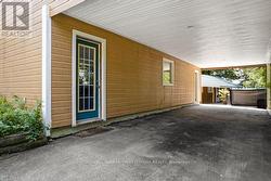 Two driveways, one paved -