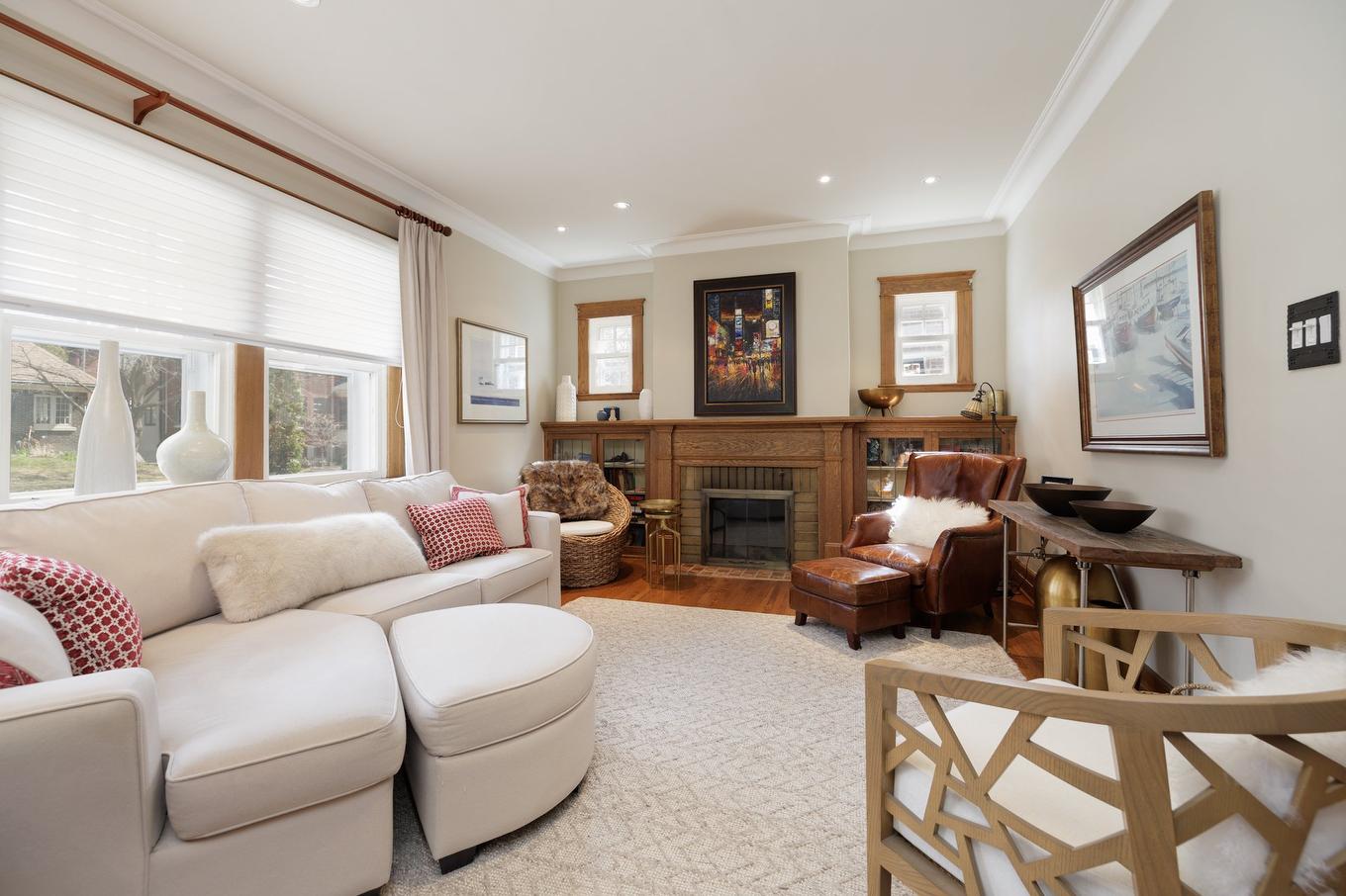 Living room - 130 Av. Ballantyne N., Montréal-Ouest, QC - Indoor Photo Showing Living Room With Fireplace