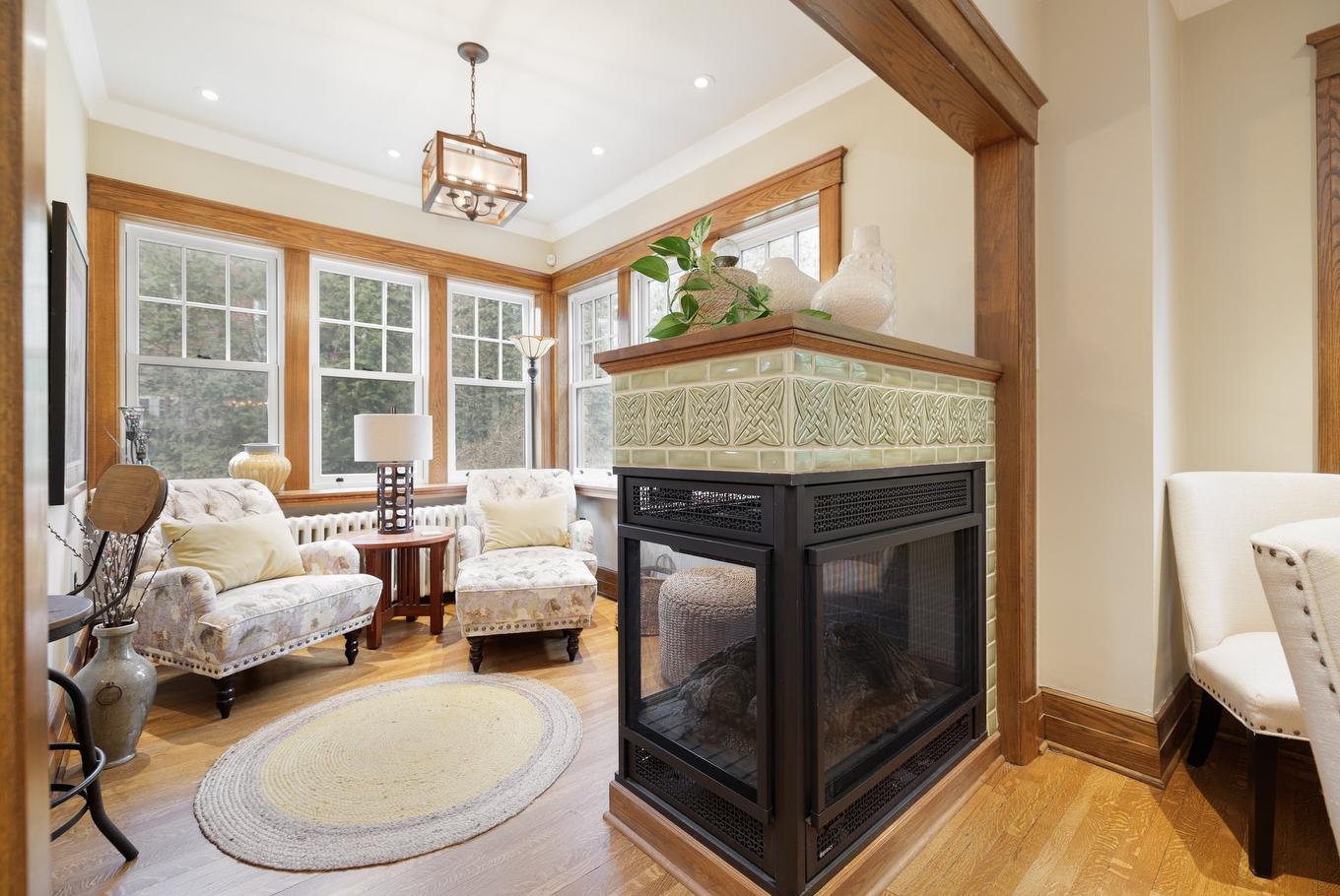 Den - 130 Av. Ballantyne N., Montréal-Ouest, QC - Indoor Photo Showing Living Room With Fireplace