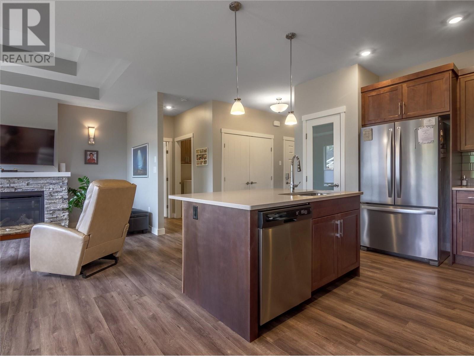 120 Sendero Crescent, Penticton, BC - Indoor Photo Showing Kitchen With Fireplace