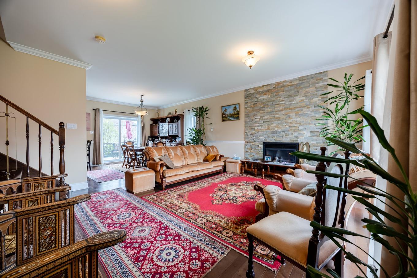 Living room - 7775 Rue De Lausanne, Brossard, QC - Indoor Photo Showing Living Room With Fireplace