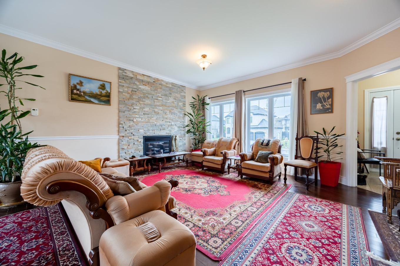 Living room - 7775 Rue De Lausanne, Brossard, QC - Indoor Photo Showing Living Room With Fireplace