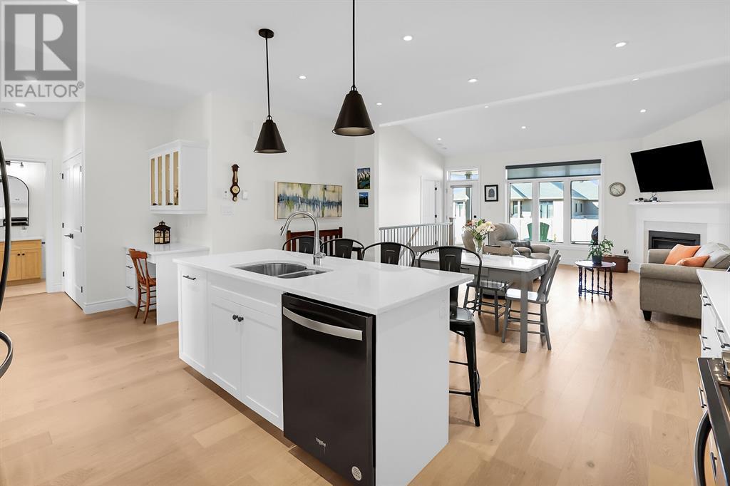102 Leneve Street, Lambton Shores, ON - Indoor Photo Showing Kitchen With Fireplace With Double Sink