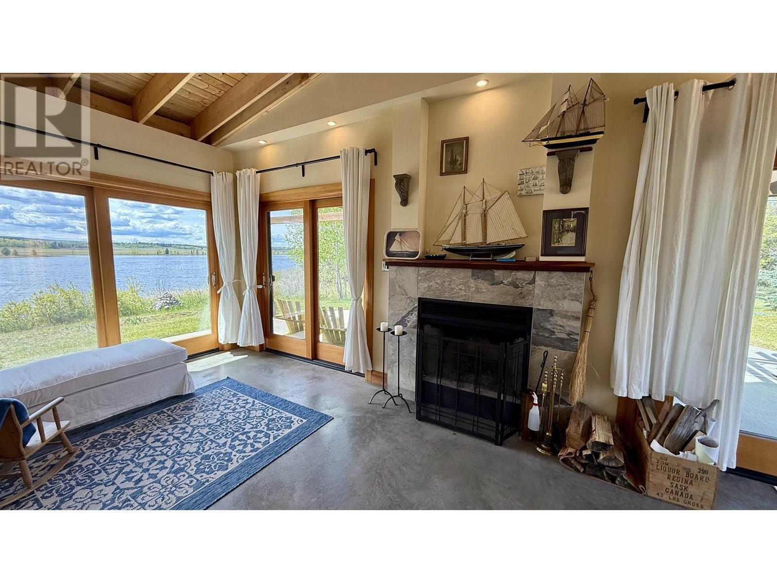 5460 Carlson Road, 100 Mile House, BC - Indoor Photo Showing Living Room With Fireplace