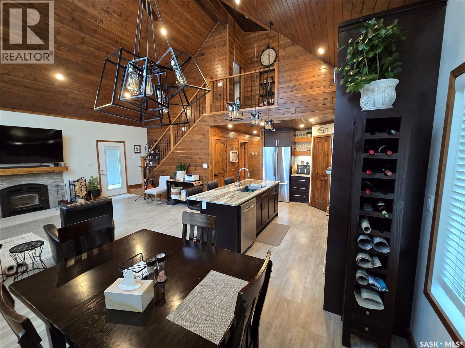 106 Lakeview Drive, Northern Admin District, SK - Indoor Photo Showing Dining Room With Fireplace