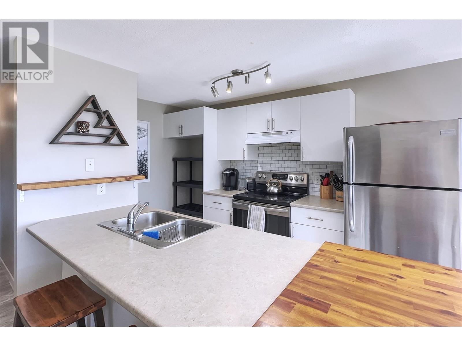 4817 Snow Pines Road Unit# D, Big White, BC - Indoor Photo Showing Kitchen With Double Sink