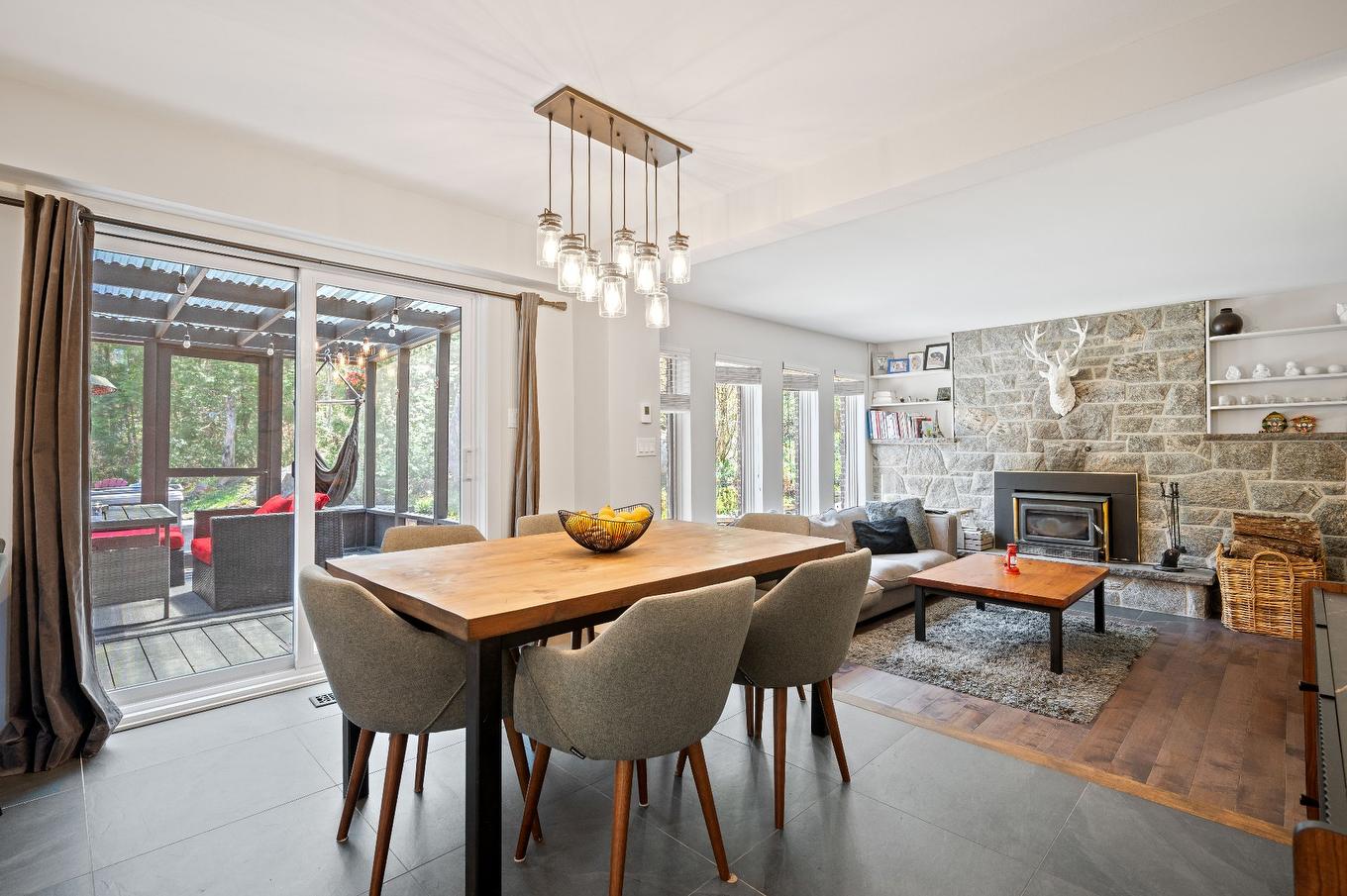 Dining room - 153 Route 323, Brébeuf, QC - Indoor Photo Showing Dining Room With Fireplace