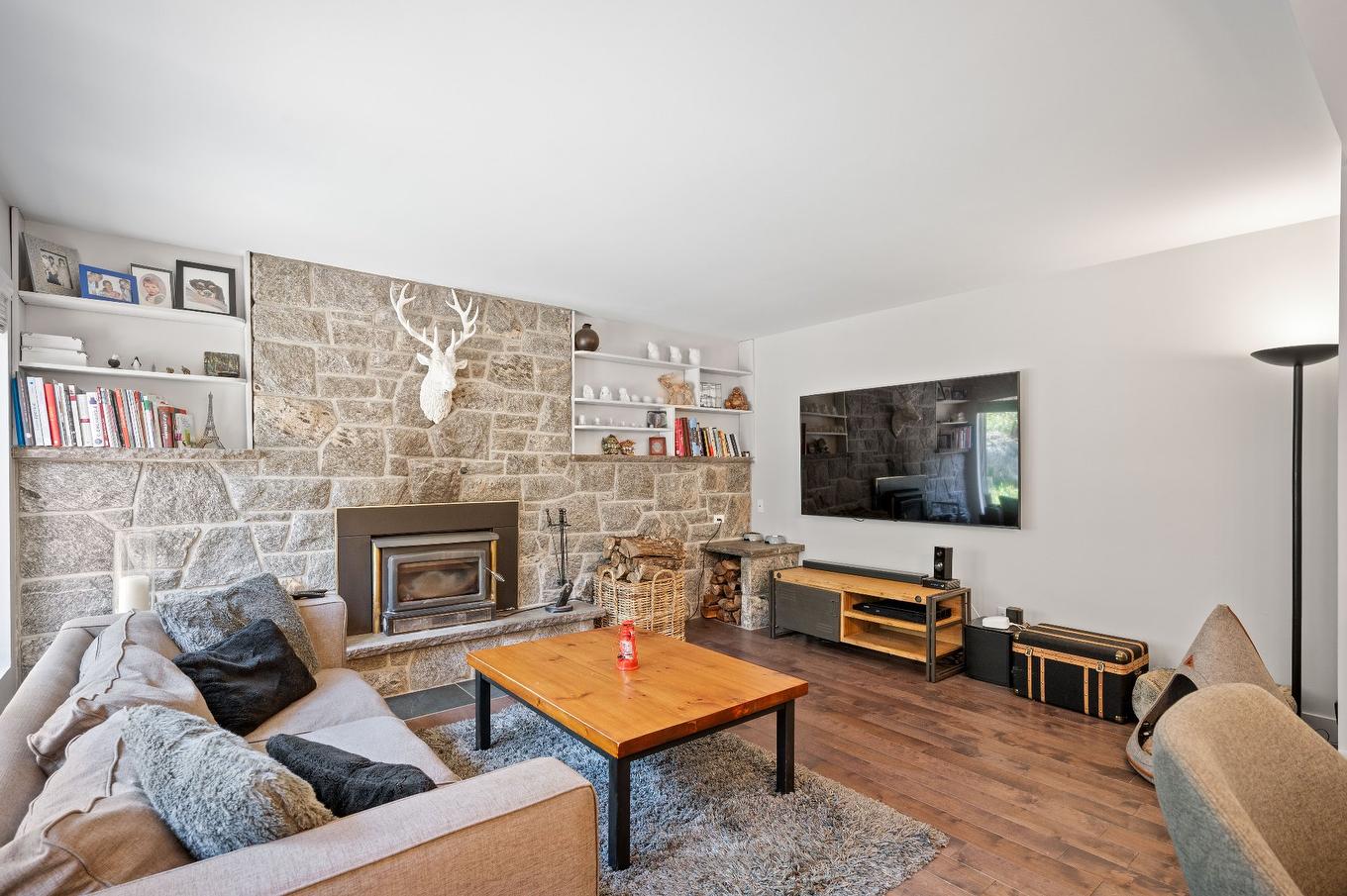 Living room - 153 Route 323, Brébeuf, QC - Indoor Photo Showing Living Room With Fireplace