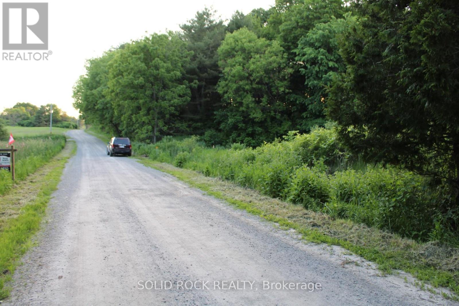 Looking west, lot is on left in this photo - 133 Webster Road, Leeds And The Thousand Islands, ON
