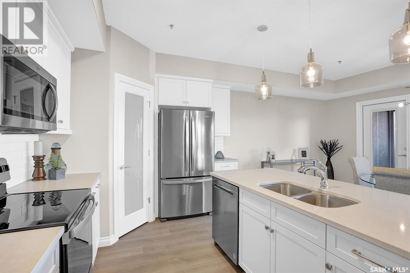 203 4594 Harbour Landing Drive, Regina, SK - Indoor Photo Showing Kitchen With Double Sink With Upgraded Kitchen