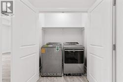 Hall laundry closet at far end of east wing -