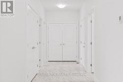 Laundry closet, drs closed, located at end of hall -