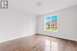 Bedroom 2 with big window, genuine hardwood -