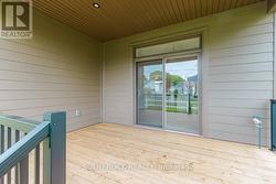 14 x 12 ft covered veranda looks over fenced yard -