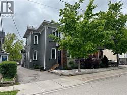 View of front of house featuring brick siding -