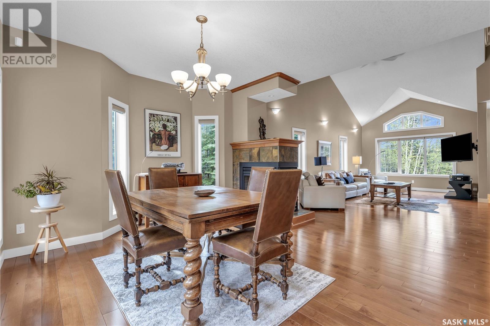 Estates Drive, Elk Ridge, SK - Indoor Photo Showing Dining Room With Fireplace