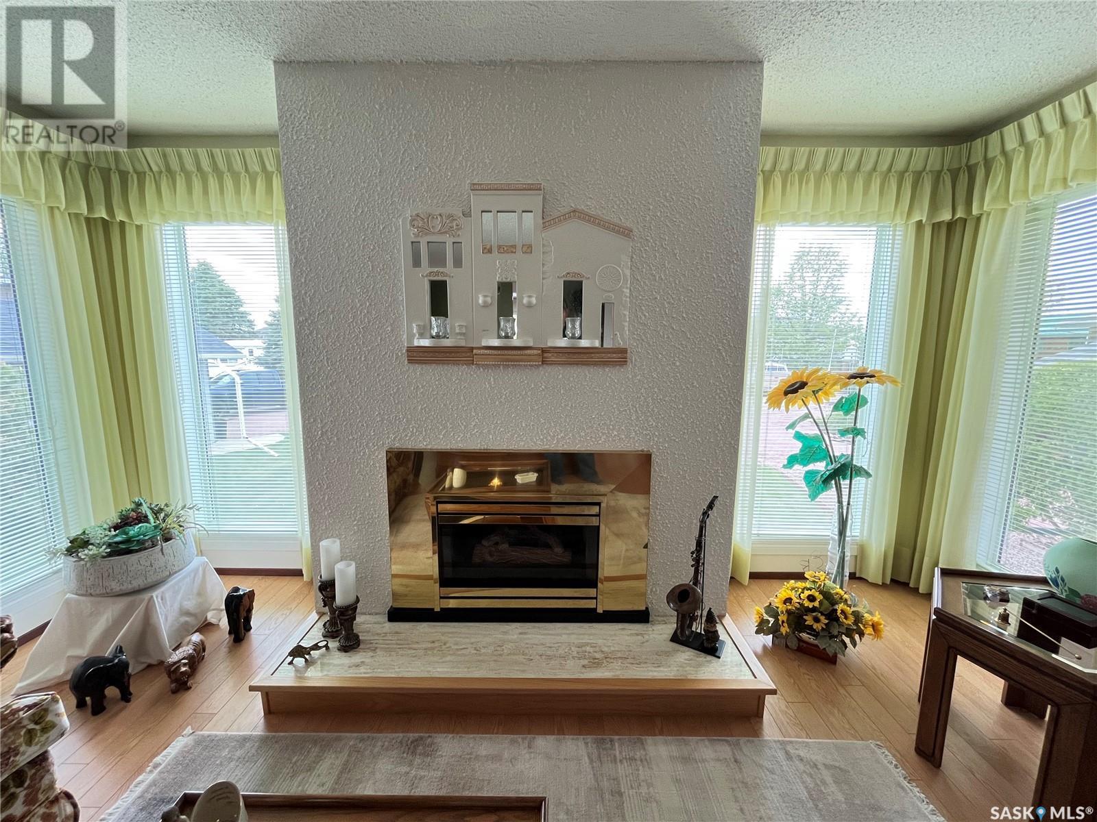 12 Chinook Place, Maple Creek, SK - Indoor Photo Showing Living Room With Fireplace