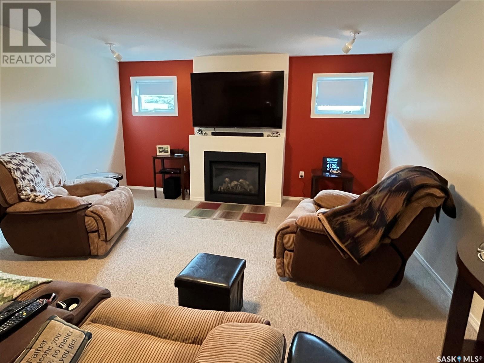 12 Chinook Place, Maple Creek, SK - Indoor Photo Showing Living Room With Fireplace