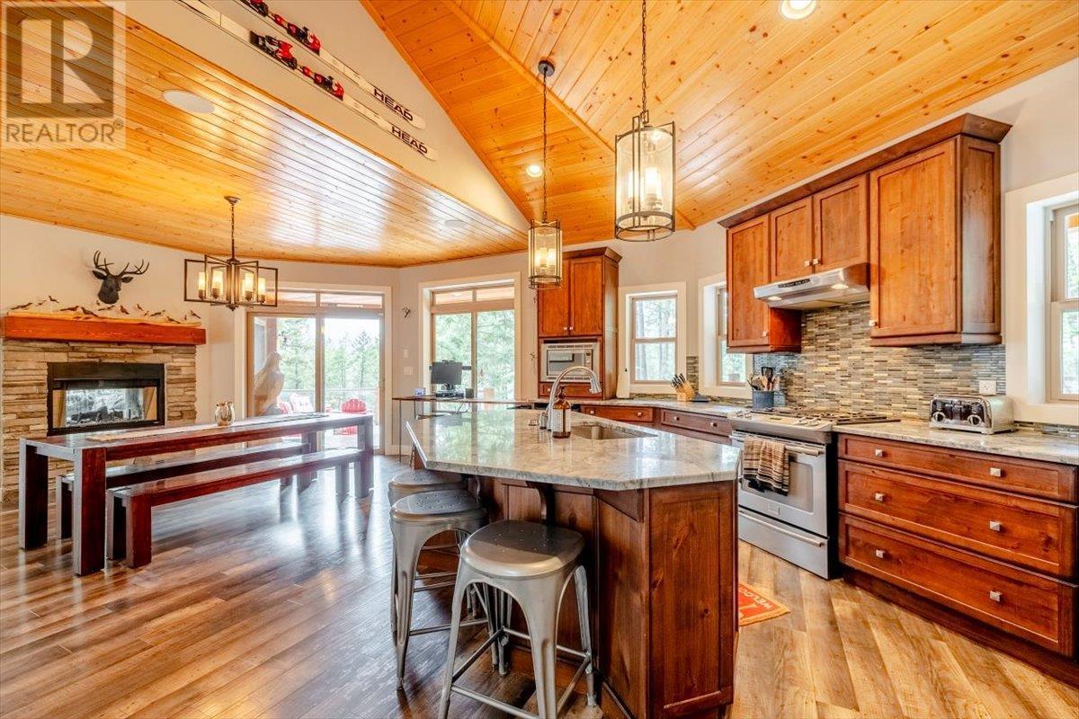 9942 Osprey Landing Drive, Wardner, BC - Indoor Photo Showing Kitchen With Fireplace
