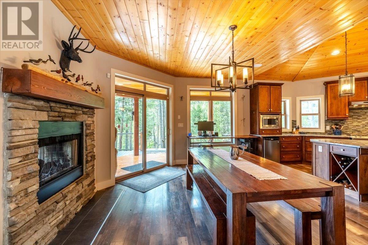 9942 Osprey Landing Drive, Wardner, BC - Indoor Photo Showing Dining Room With Fireplace