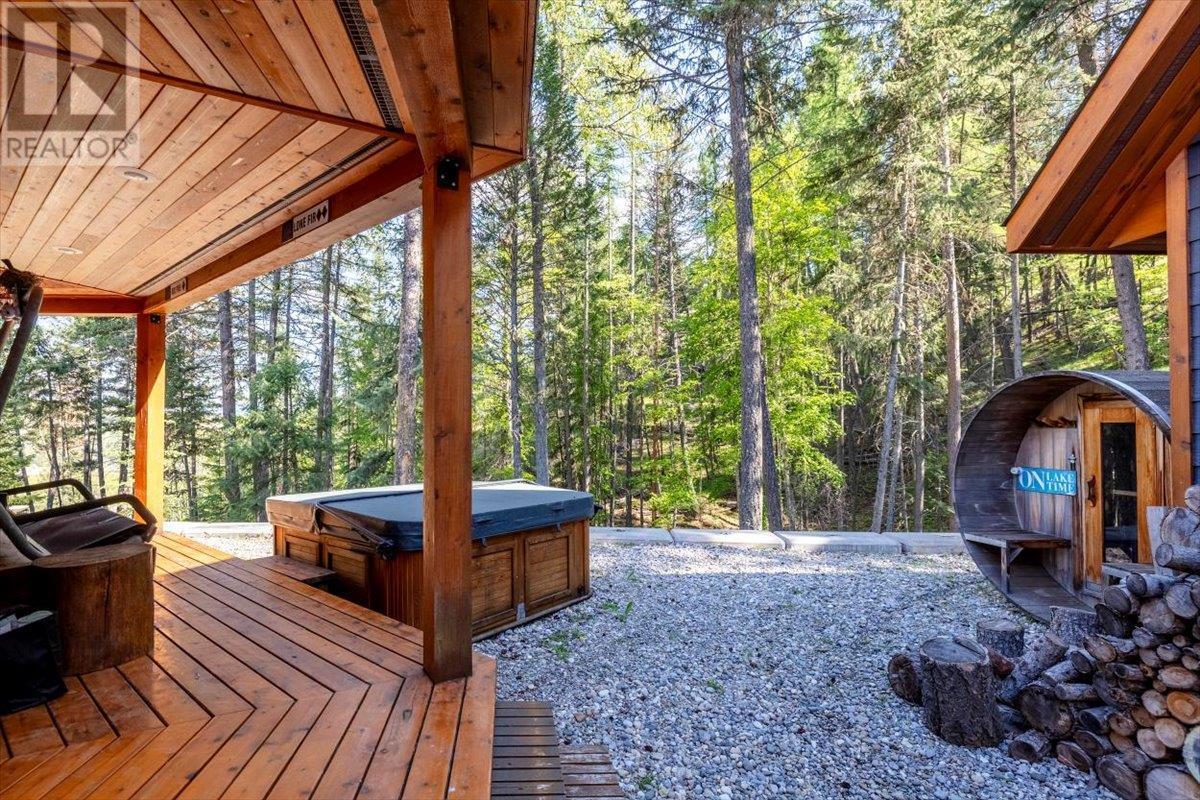 Salt water hot tub - 9942 Osprey Landing Drive, Wardner, BC - Outdoor With Deck Patio Veranda With Exterior