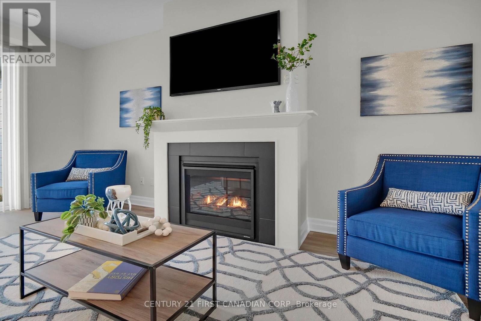 403 Breakwater Boulevard, Central Elgin (Port Stanley), ON - Indoor Photo Showing Living Room With Fireplace
