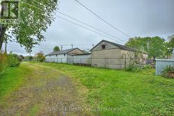 GATED SIDE ENTRANCE OFF MELLANBY LEADING TO REA -