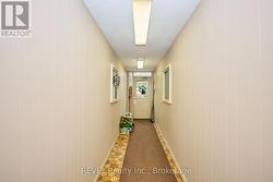 HALLWAY FROM FRONT DOOR TO RESIDENTIAL UNIT -