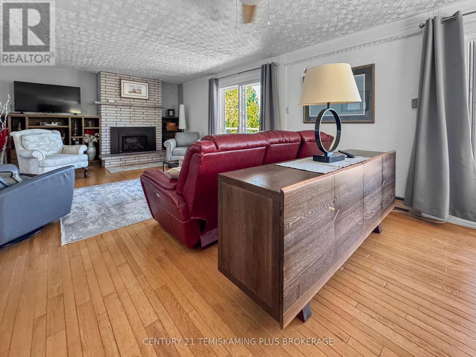 501178 Berry Road, Timiskaming (Tim - Outside - Rural), ON - Indoor Photo Showing Living Room With Fireplace
