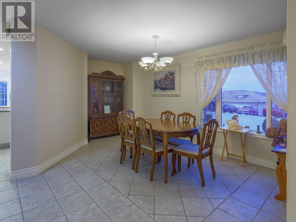 Dining room area with large windows - 11900 Olympic View Drive, Osoyoos, BC - Indoor Photo Showing Dining Room