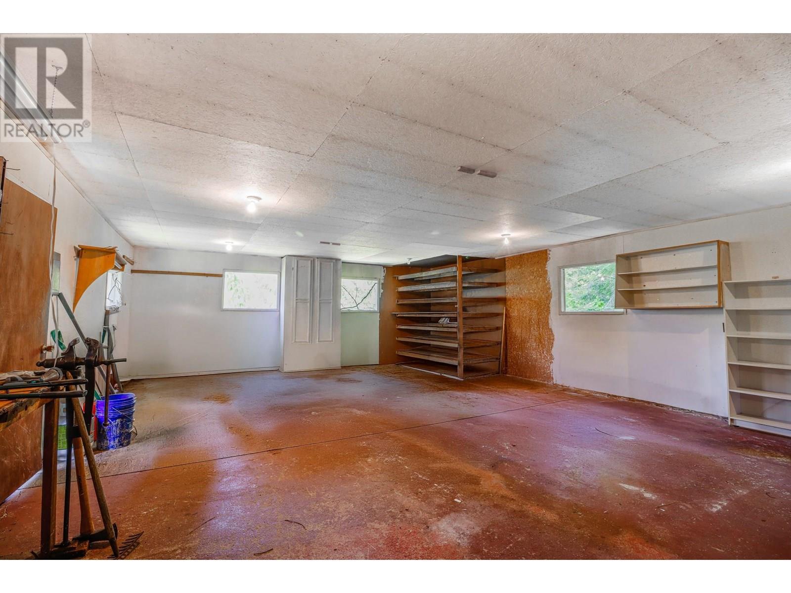 Large shop with wood storage below - 15730 Peters Road, Crawford Bay, BC - Indoor