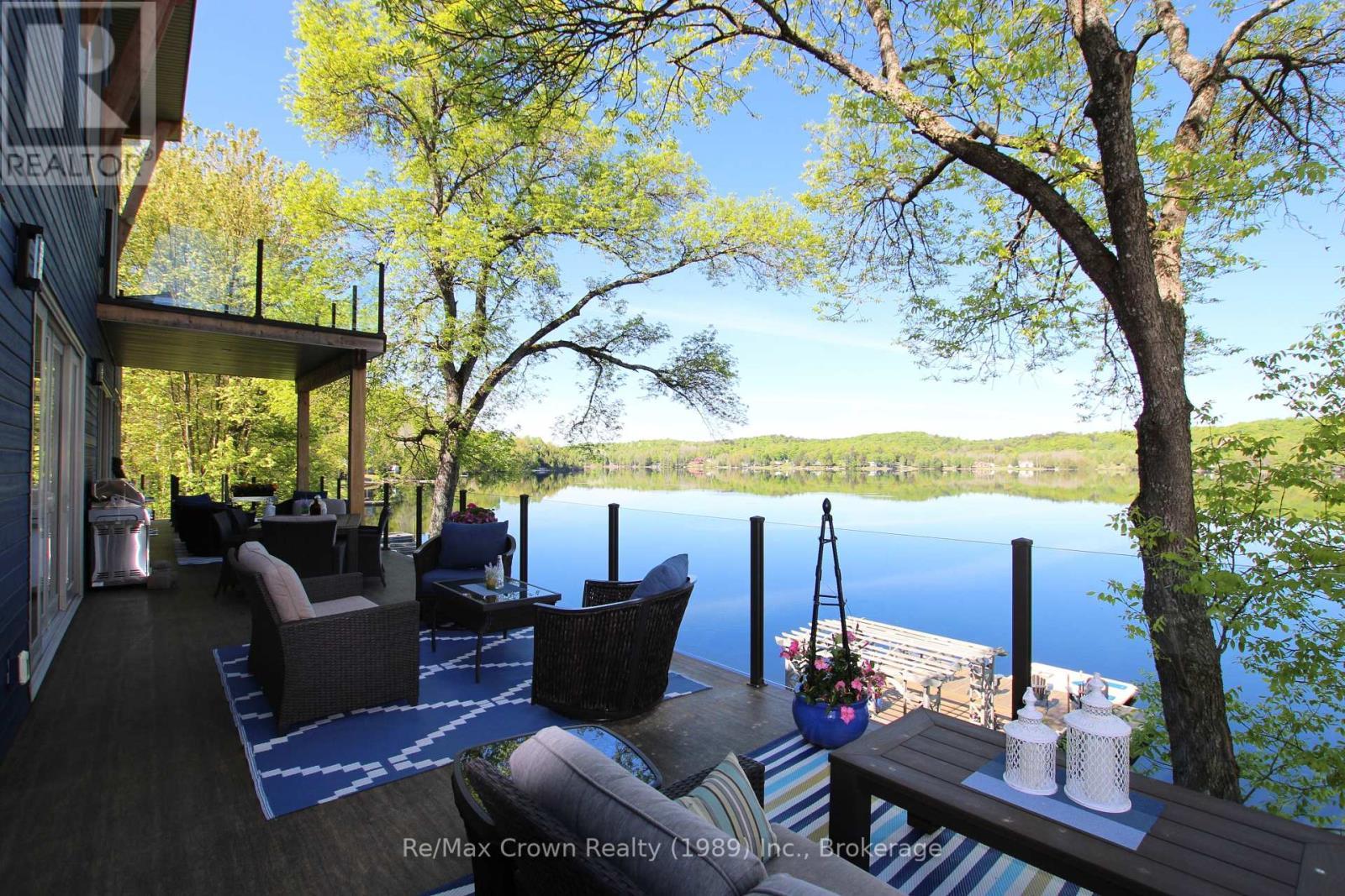 7313 Highway 534 Highway, Parry Sound Remote Area (Restoule), ON - Outdoor With Body Of Water With Deck Patio Veranda