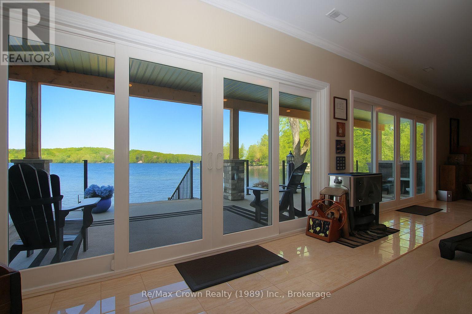 7313 Highway 534 Highway, Parry Sound Remote Area (Restoule), ON - With Body Of Water With Deck Patio Veranda With Exterior