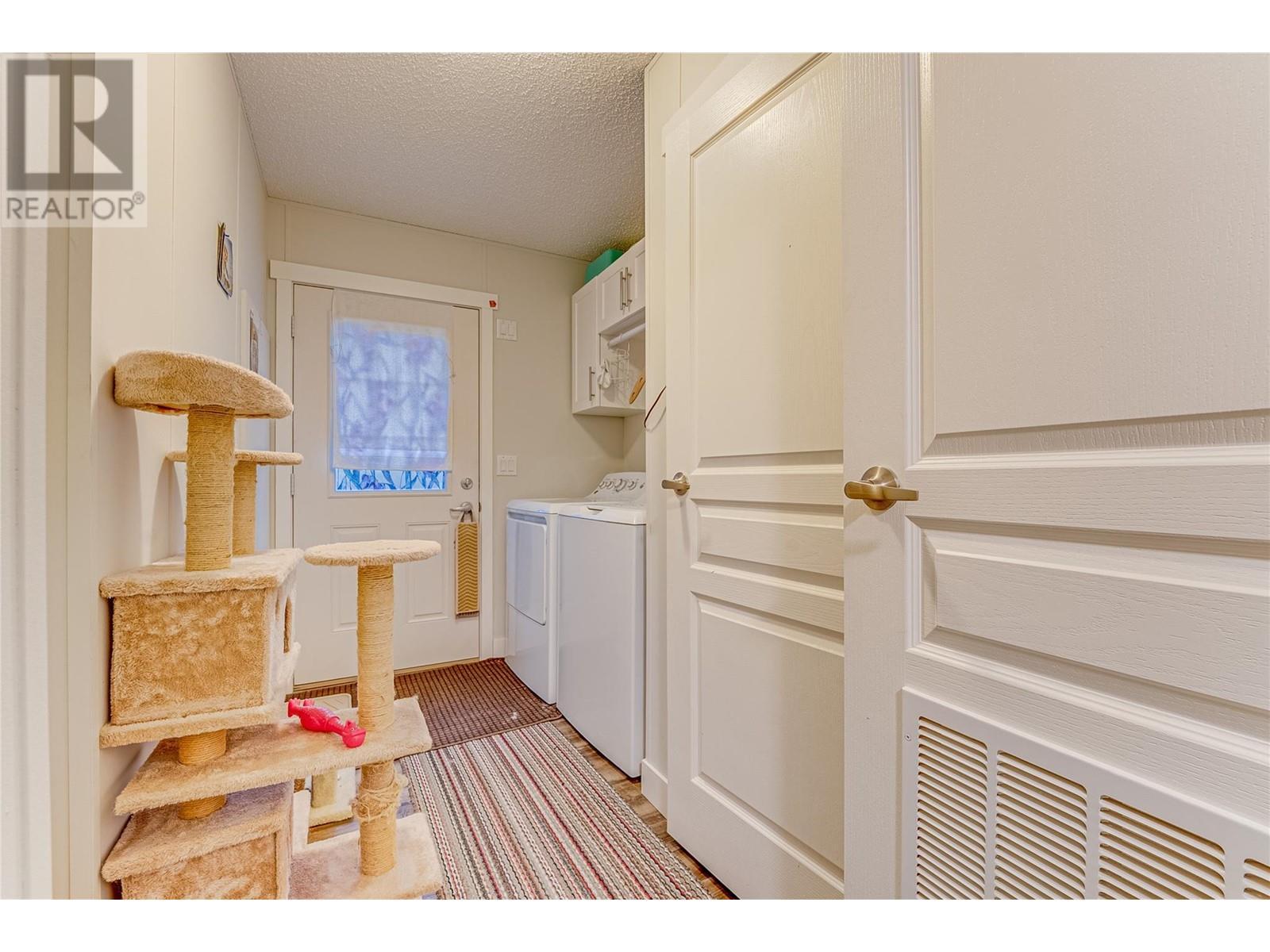 Laundry room and back door - 1600 43 Avenue Unit# 25, Vernon, BC