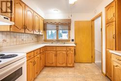 kitchen and door to landing to garage and basement -