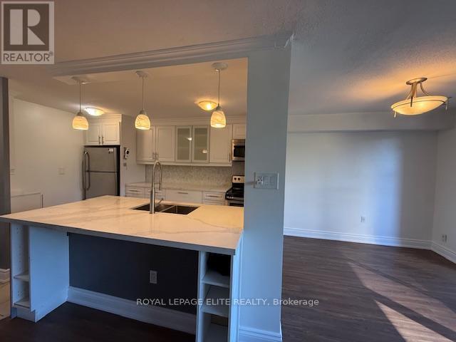 310 - 3120 Kirwin Avenue, Mississauga, ON - Indoor Photo Showing Kitchen With Double Sink