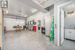 Third garage, heated, with 2 piece bath (with a window) Double doors to side yard -