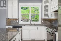 Love the window above the sink - easy to look in the back yard while doing the dishes -