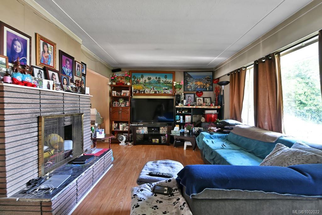 307, 311,315 Holly Ave, Nanaimo, BC - Indoor Photo Showing Living Room With Fireplace