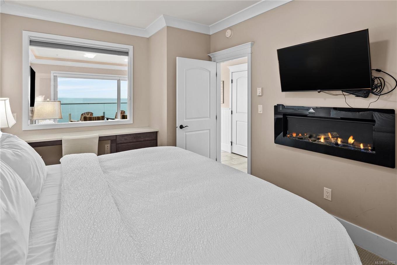 42B-1000 Sookepoint Pl, Sooke, BC - Indoor Photo Showing Bedroom With Fireplace