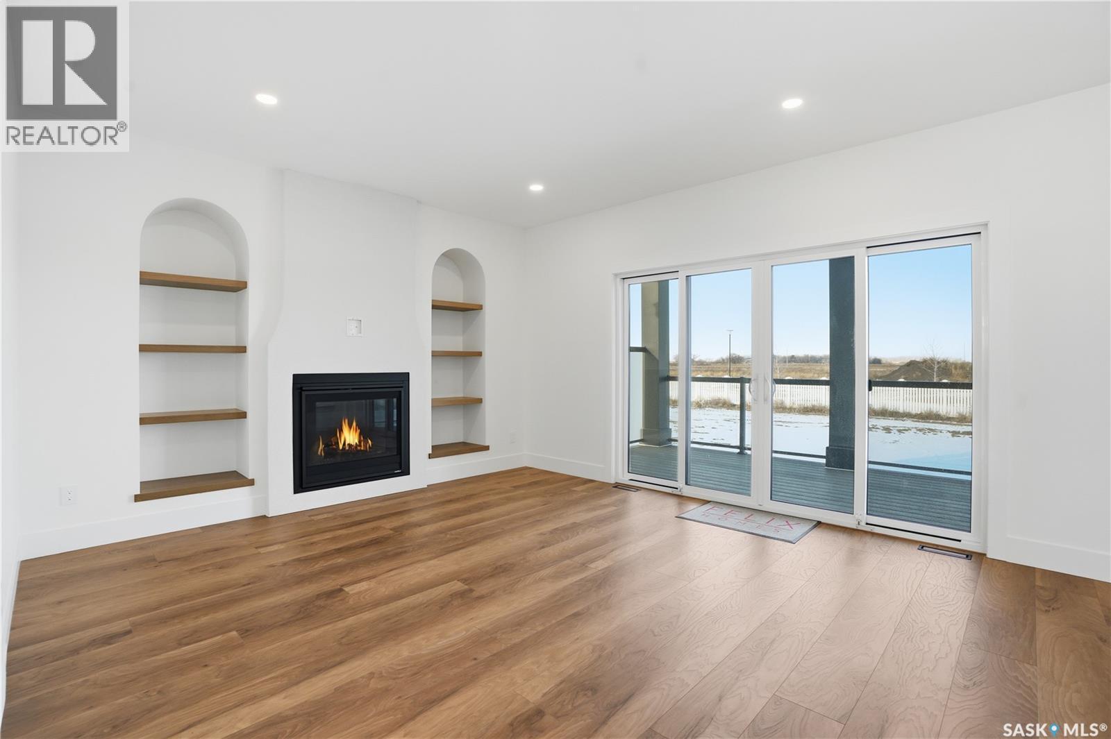 436 Augusta Boulevard, Warman, SK - Indoor Photo Showing Other Room With Fireplace