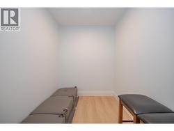 Walk in closet in basement bedroom -