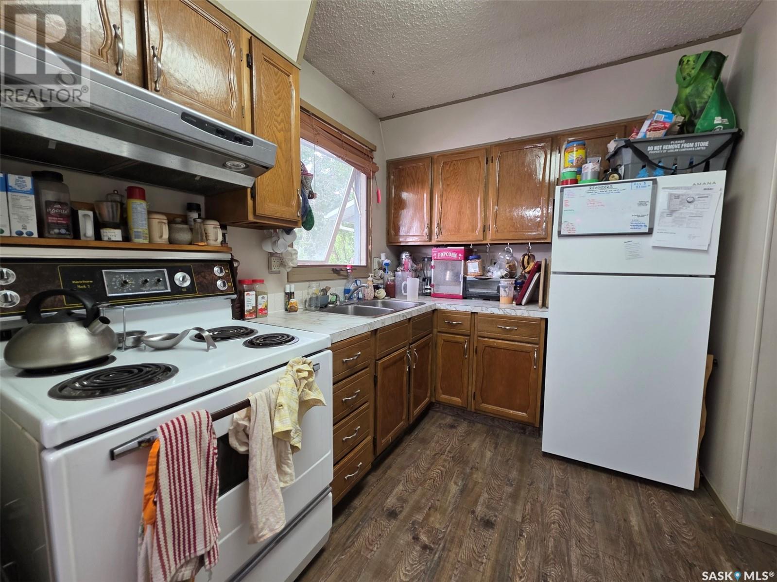 11 Keeler Street, Waldeck, SK - Indoor Photo Showing Kitchen With Double Sink