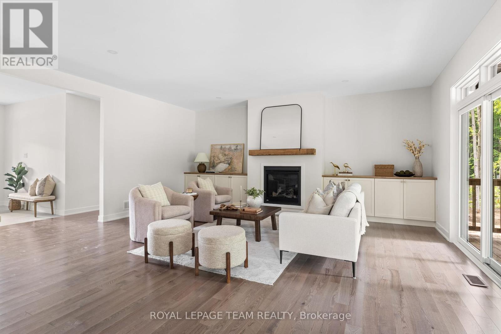 Similar model image; builder variations possible. - 47 Hogan Drive, Mcnab/Braeside, ON - Indoor Photo Showing Living Room With Fireplace