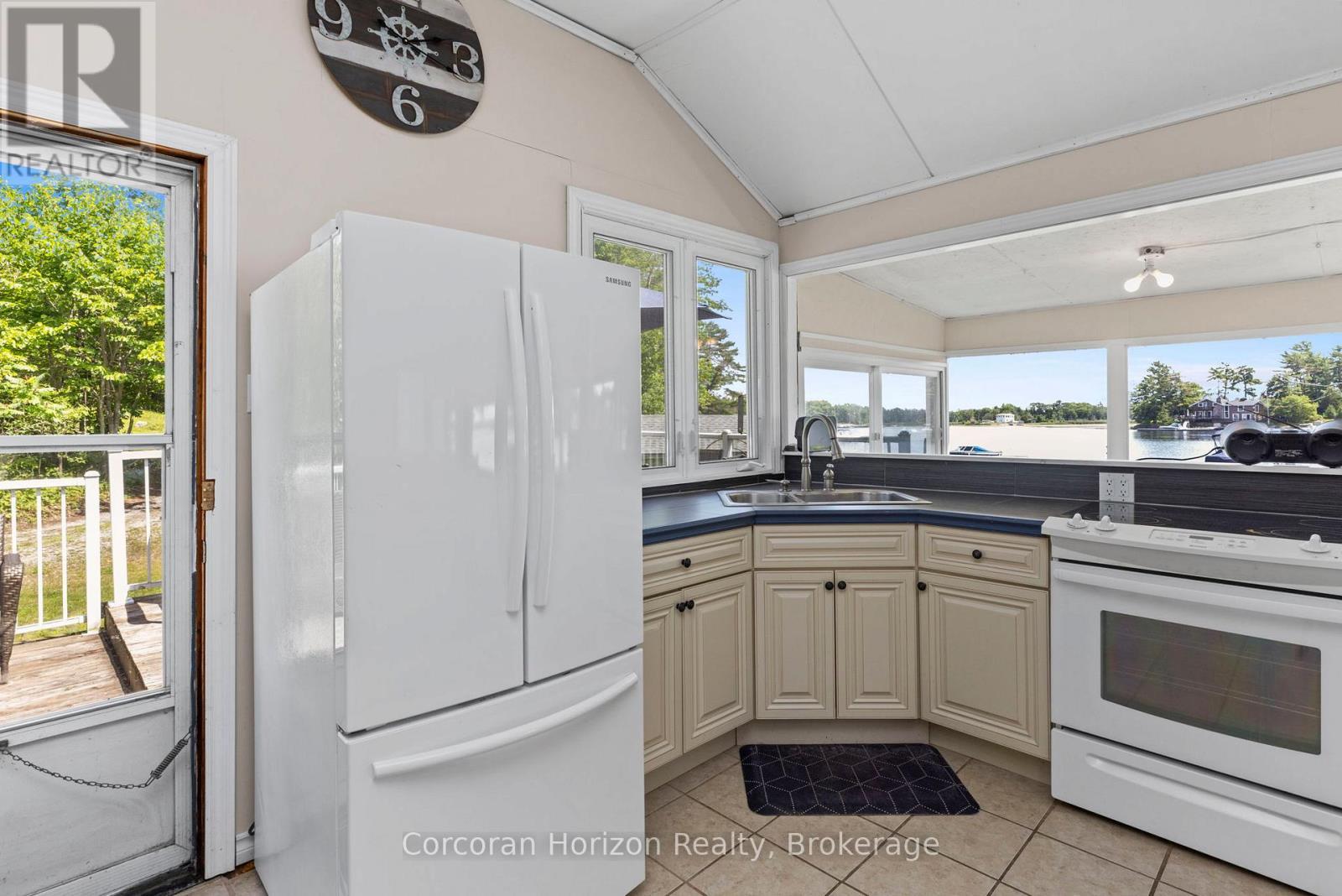 68 Wolverine Beach Rd, Georgian Bay (Baxter), ON - Indoor Photo Showing Kitchen With Double Sink